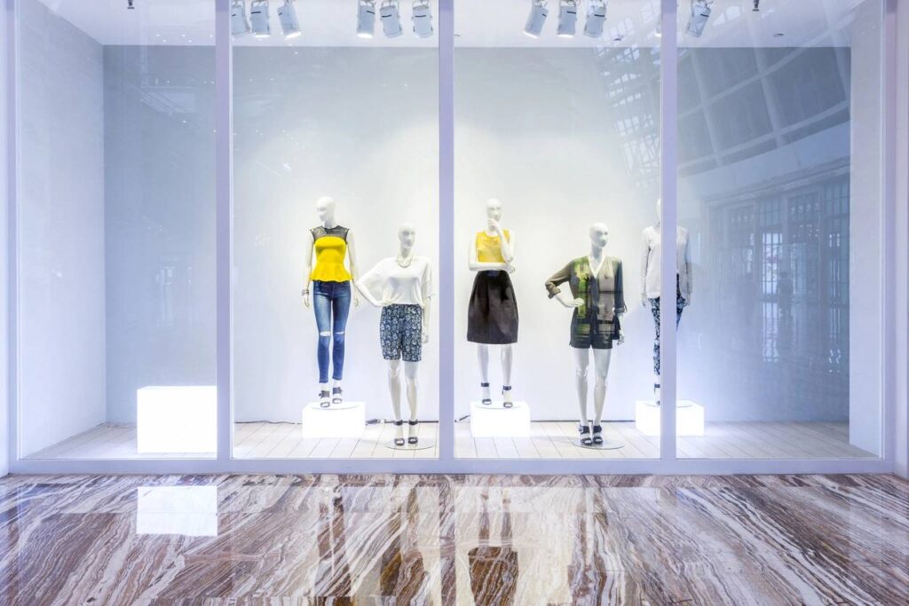 mannequins in fashion shop display window